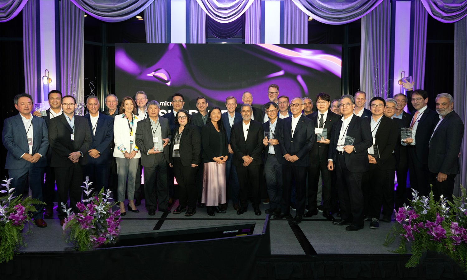 group photo of micron executives at supplier awards event